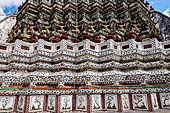 Bangkok Wat Arun - Detail of the indented base of the Phra prang decorated with Chinese ceramic.